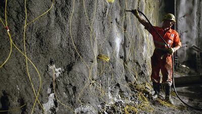 A miner preparing a blasting operation in the Gotthard Base Tunnel. Martin Ruetschi / EPA