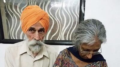 Mohinder Singh Gill poses with his wife Daljinder Kaur and their newly born baby at The National Fertility Centre in Hisar, India. AFP Photo
