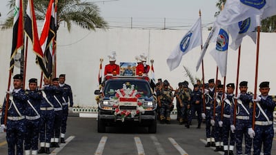 A vehicle transports a mock coffin of Major General Ali al-Lami, who commands the Iraqi Federal Police's Fourth Division, who was killed in the Zor area north of Samara in Salahuddin, during a symbolic funeral ceremony in Baghdad, Iraq. Reuters
