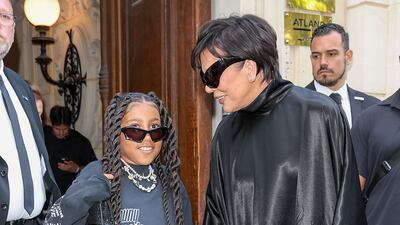 North West and Kris Jenner arrive at the show. Getty Images