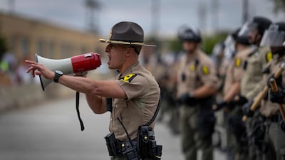 Police face protesters outside the immigration processing and detention facility in Broadview, Illinois. Getty Images via AFP