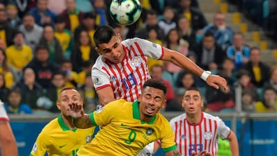 Brazil's Jesus and Paraguay's Junior Alonso vie for the ball. AFP