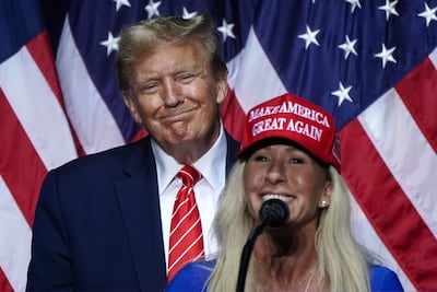 Representative Marjorie Taylor Greene with Donald Trump at a campaign event in Rome, Georgia, on March 9, 2024. AFP