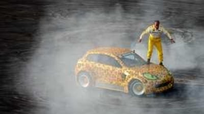 Stunt car racer Terry Grant performs at the Renault Road Show.