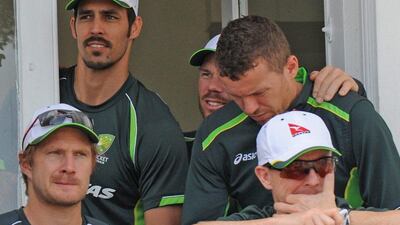 Australia’s Shane Watson, front left, Chris Rogers, front right, Mitchell Johnson, rear left, David Warner and Peter Siddle, rear right, on team balcony after England beat Australia by an innings and 78 runs to win the Ashes during day three of the fourth Ashes Test cricket match, at Trent Bridge, Nottingham, England, Saturday, Aug. 8 2015. (AP Photo/Rui Vieira)