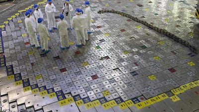 People take part in a guided tour inside the inoperative Ignalina nuclear power plant.