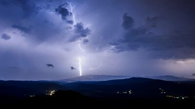 Lightning strikes from dark clouds during a storm near Salgotarjan, Hungary. EPA / Peter Komka