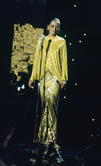 Diana Ross in a gold-sequinned 'watermelon' gown by Bob Mackie, in 1976. Getty