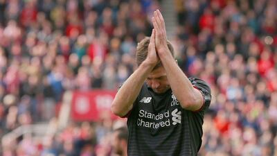 Steven Gerrard of Liverpool applauds the supporters after his side's final Premier League match on the season on Sunday, a 6-1 loss at Stoke City. Dave Thompson / Getty Images / May 24, 2015