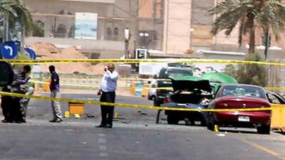 A damaged car is seen at the site of a rocket attack, in front of the Intercontinental Hotel in the Red Sea port of Aqaba, Jordan on Monday.
