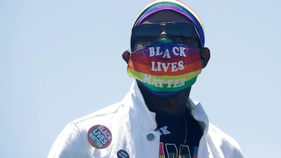 Erik Webb wears a rainbow face mask during the coronavirus outbreak in San Francisco, California this week. AP Photo