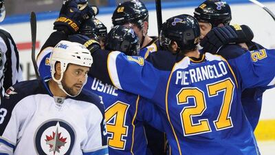 The St Louis Blues celebrate following Alexander Steen's game-winning goal on Tuesday. Bill Boyce / AP