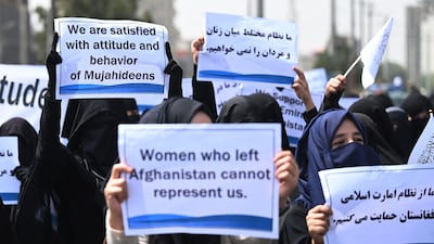 The veiled women hold banners and placards proclaiming their backing for the militant group who have taken over Afghanistan. AFP