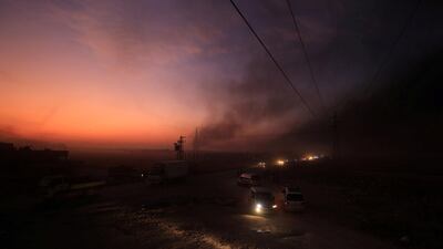 Vehicles are seen as people flee Ras Al Ain town, Syria October 9, 2019. Reuters