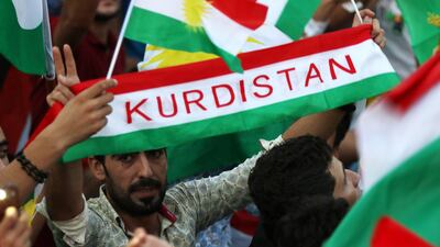 Iraqi Kurds fly Kurdish flags during an event to urge people to vote in the upcoming independence referendum in Erbil, the capital of the autonomous Kurdish region of northern Iraq, on September 16, 2017