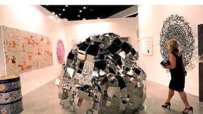 The stainless-steel sculpture Lancelot's Helmet, which is described by organisers as a metaphor for life, and which was created by the San Francisco sculptor Alexis Laurent, was on display by the New York-based LTMH Gallery during the Jumeirah Patrons' Preview at Art Dubai last week. Amy Leang / The National