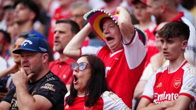 Arsenal fans look on nervously. PA