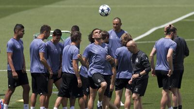 Real Madrid's Pepe heads a ball during the training session. Paul White / AP