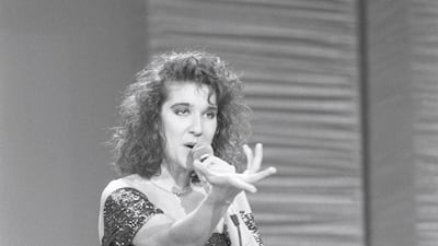 Celine Dion, in metallic peak-1980s ruffles, performs at a preliminary competition for the Eurovision Song Contest on February 7, 1988. EPA