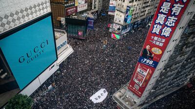 Protesters hold banners and shout slogans as they march on a street in Hong Kong China. Large numbers of protesters rallied on Sunday despite an announcement yesterday by Hong Kong's Chief Executive Carrie Lam that the controversial extradition bill will be suspended indefinitely. Getty Images