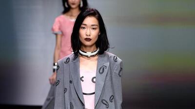 A model walks the runway during the Emporio Armani show at Milan Fashion Week spring/summer 2016. Courtesy of Pietro D’Aprano/Getty Images