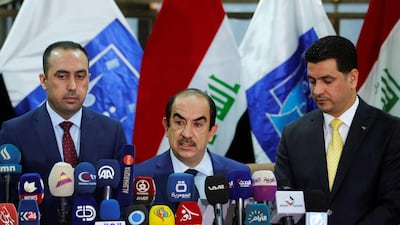 Riyadh Al Badran, the head of Iraq's Independent Higher Election Commission, announces the final count from the parliamentary election at a press conference in Baghdad on May 19, 2018. Khalid Al Mousily / Reuters