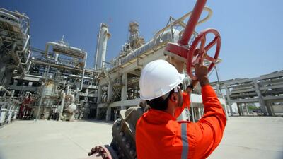 Qatar, the world’s largest exporter of liquefied natural gas, has implemented a raft of reforms aimed at lowering expenditure and shoring up non-oil revenue. Above, a worker at the Ras Laffan gasfield in Qatar. Greg Newington / Getty Images