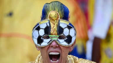 Colombian super fan El Cole cheers on his team against Uzbekistan in the World Cup, at Mexico City Stadium. AFP