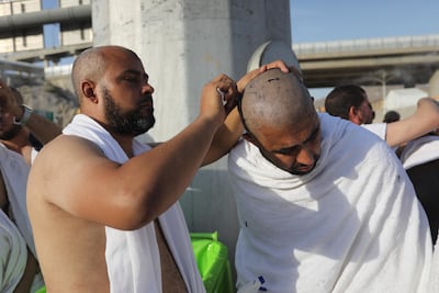 Muslim pilgrims cut their hair upon performing Hajj rites on the first day of Eid Al Adha. AFP