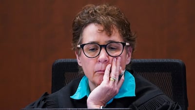 Ms Azcarate listens. AP