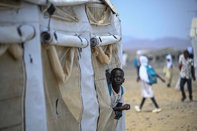 A displaced Sudanese pupil at a makeshift elementary school run by the Sudanese Coalition for Education, in partnership with the UN's children and women's agency Unicef, south of Port Sudan. AFP