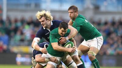 Johnny Sexton of Ireland is tackled by Richie Gray of Scotland during their Six Nations match at the Aviva Stadium in Dublin on February 2, 2014. David Rogers / Getty Images