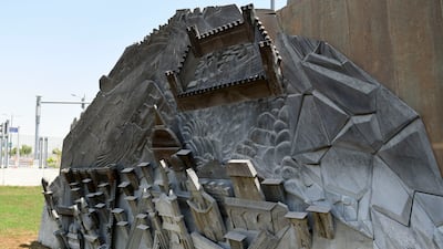 Wooden carvings by Wael Shawky at the Special Olympics Gardens. Khushnum Bhandari / The National