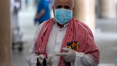 A Jordanian returning from abroad arrives at the Queen Alia International Airport in Amman. EPA