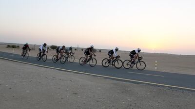 Cyclists riding their bicycle on the Al Qudra cycle track in Dubai ( Pawan Singh / The National )