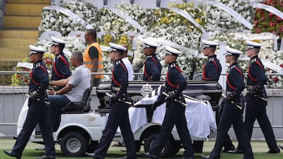 The casket of the late Pele is moved from the Urbano Caldeira Stadium, where his supporters paid their last respects. Reuters