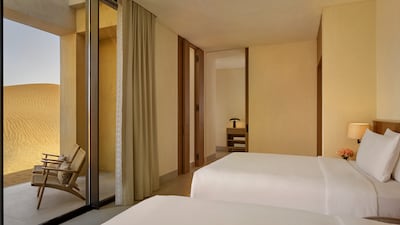 The twin bedroom also has a private balcony with direct access to the desert