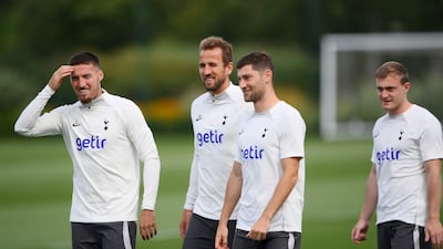 Harry Kane speaks to Matt Doherty and Ben Davies. Getty