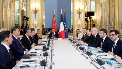 Mr Xi and Mr Macron with their delegations at a working session at the Elysee Palace. EPA