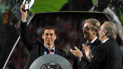 Lille's French coach Rudi Garcia celebrates with L1 title's trophy on May 29, 2011. AFP