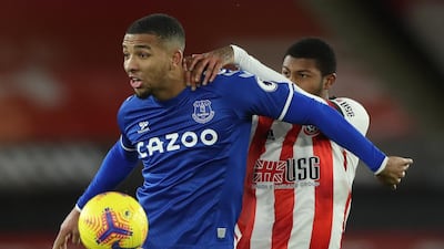 Everton's Mason Holgate under pressure from Sheffield United striker Rhian Brewster. AFP