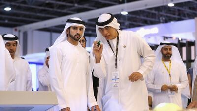 Sheikh Hamdan bin Mohammed, Crown Prince of Dubai, speaks to Ahmed Al Khatib during Cityscape Global. Francois Nel / Getty Images