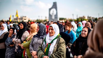 People mourn as they attend the funeral of an Arab fighter in the Kurdish-led Syrian Democratic Forces (SDF). AFP