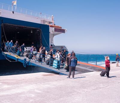 Visitors arrive in Mykonos, Greece. Courtesy Bloomberg