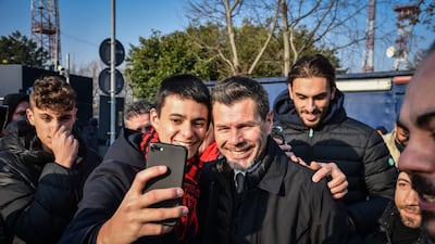 Milan supporters make a selfie with Croatian former player Zvonimir 'Zorro' Boban as they wait for the arrival of Zlatan Ibrahimovic. EPA
