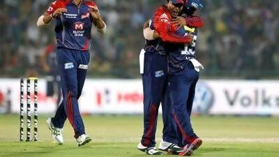 Delhi Daredevils' Mahela Jayawardene, centew, and teammates celebrate the dismissal of Kings XI Punjab's David Miller last night. Manish Swarup / AP