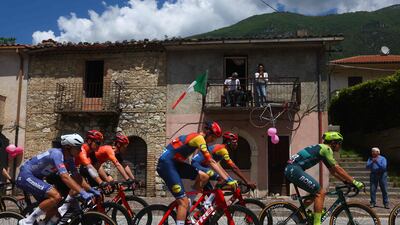 Riders pass through the village of Santa Restituta. AFP