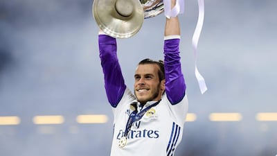 Gareth Bale of Real Madrid lifts the Uefa Champions League trophy after his side beat Juventus 4-1 in the final at the National Stadium of Wales on June 3, 2017 in Cardiff, Wales. Matthias Hangst / Getty Images