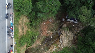 The aftermath of a bus crash in Remedios, Colombia in which more than a dozen schoolchildren and the driver were killed. AFP