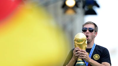 Germany's captain Philipp Lahm celebrates with the trophy during their victory parade. Robert Michael / AFP